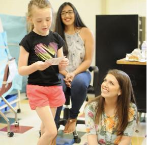 Student teacher observing young student